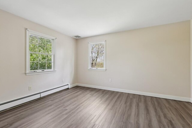 89 Brush Hill Rd, Sherborn, MA 01770 - unfurnished room featuring visible vents, a baseboard radiator, baseboards, and wood finished floors