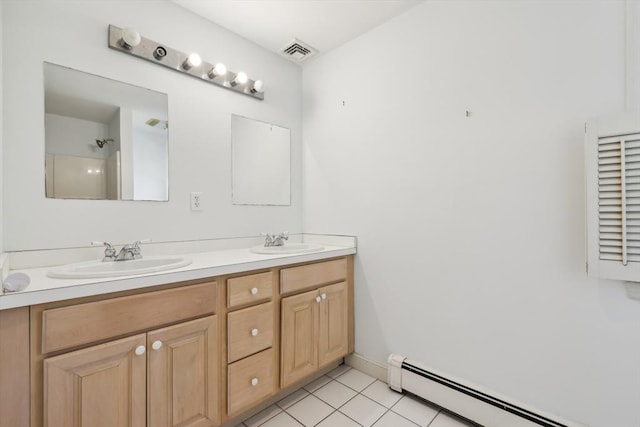 89 Brush Hill Rd, Sherborn, MA 01770 - full bathroom with double vanity, baseboard heating, visible vents, and a sink