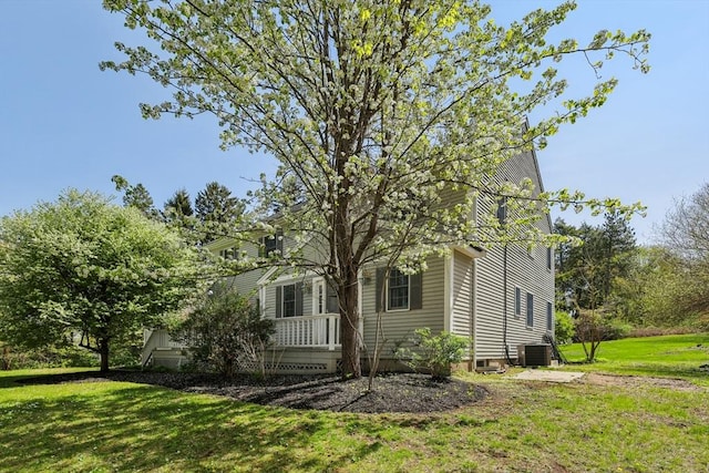 89 Brush Hill Rd, Sherborn, MA 01770 - view of home's exterior with central AC unit and a yard