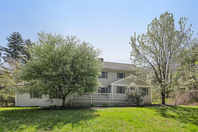 89 Brush Hill Rd, Sherborn, MA 01770 - rear view of house with a yard and a wooden deck