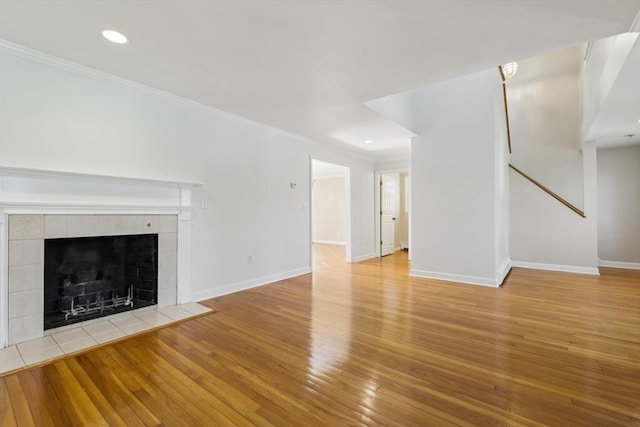 89 Brush Hill Rd, Sherborn, MA 01770 - unfurnished living room featuring crown molding, recessed lighting, baseboards, and hardwood / wood-style floors