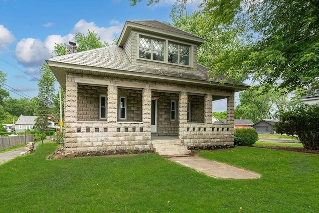 50 Switzer Ave, Springfield, MA 01109 - view of front of house featuring a porch, stone siding, and a chimney