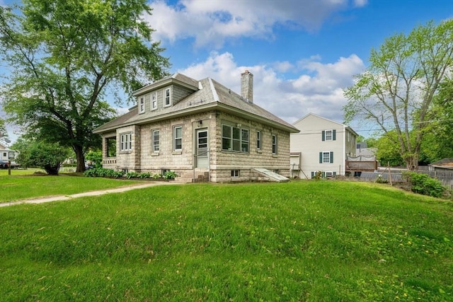 50 Switzer Ave, Springfield, MA 01109 - view of front facade with a chimney and entry steps