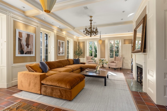 living room with coffered ceiling and ornamental molding