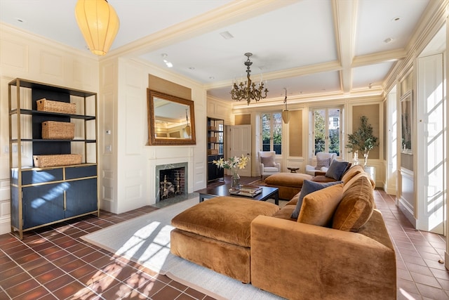 tiled living room featuring a fireplace, crown molding, beamed ceiling, and a notable chandelier