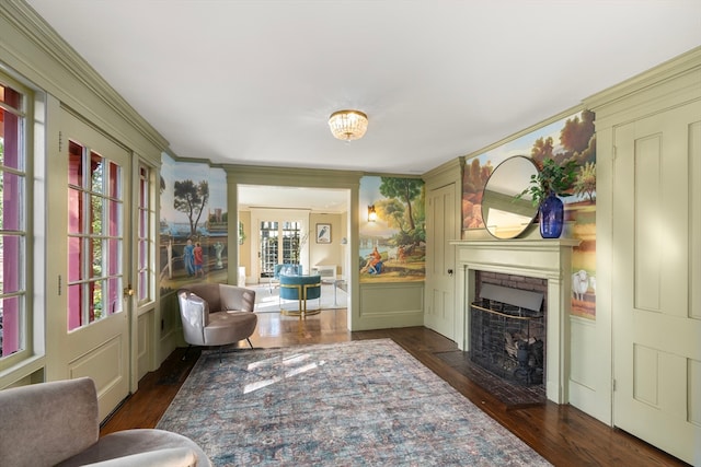 living room featuring crown molding and dark hardwood / wood-style flooring