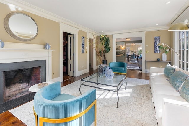 living room with hardwood / wood-style flooring and crown molding