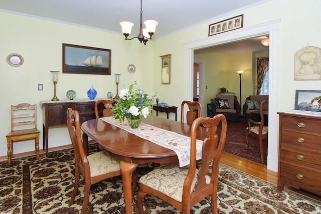 27 Ocean Ave Unit 1, Salem, MA 01970 - dining space featuring wood finished floors, ornamental molding, and a chandelier