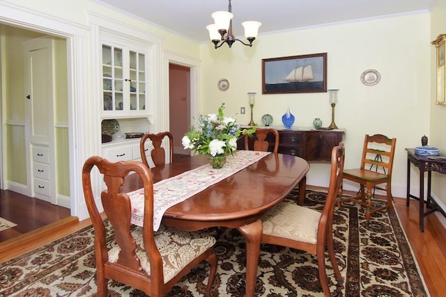 27 Ocean Ave Unit 1, Salem, MA 01970 - dining space featuring wood finished floors, a chandelier, and ornamental molding