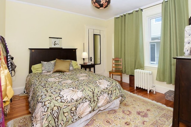 27 Ocean Ave Unit 1, Salem, MA 01970 - bedroom featuring radiator, wood finished floors, and ornamental molding