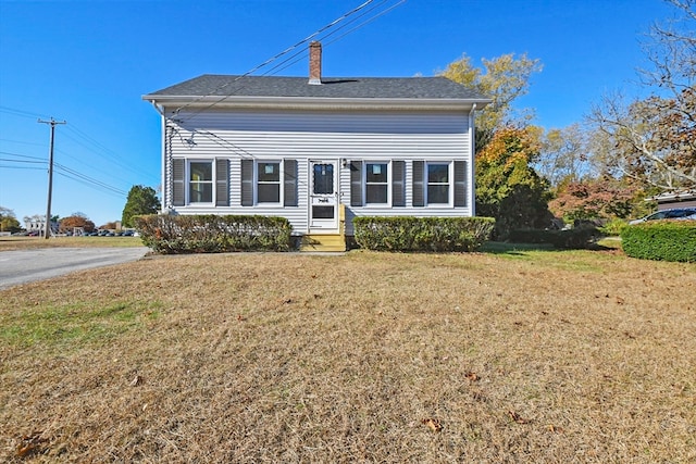 view of front of home with a front yard