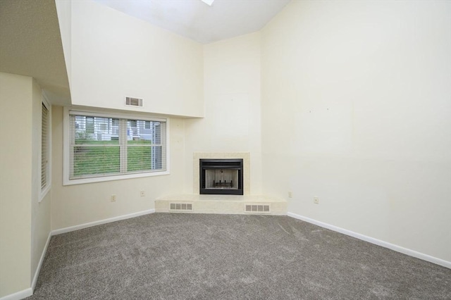 unfurnished living room featuring visible vents and carpet