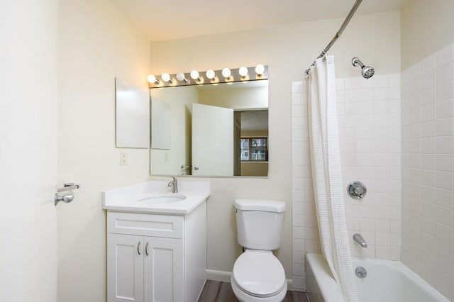 full bathroom featuring vanity, shower / bath combination with curtain, and toilet