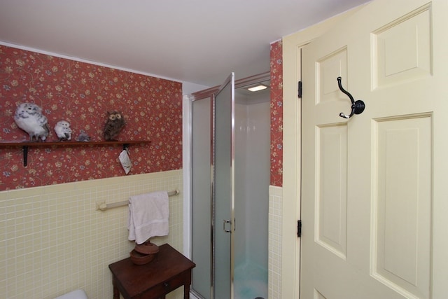 bathroom with tile walls and an enclosed shower