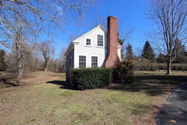 view of home's exterior featuring a lawn