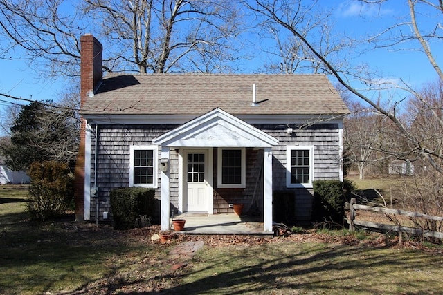 back of property featuring a yard