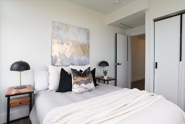 bedroom featuring a closet and baseboards