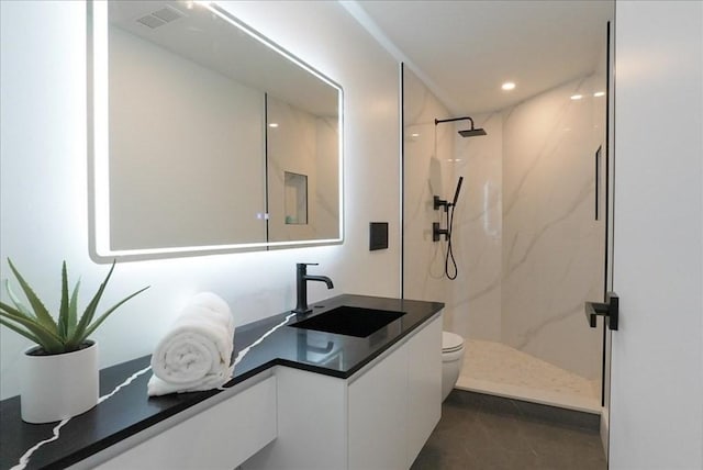 full bath with vanity, recessed lighting, toilet, a marble finish shower, and visible vents
