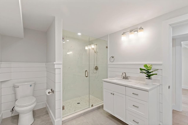 33 Dexter Ave, Sandwich, MA 02563 - bathroom featuring a marble finish shower, toilet, vanity, and tile patterned flooring