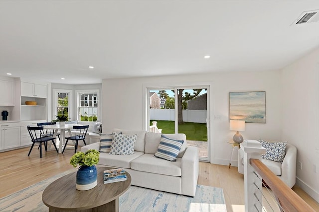 33 Dexter Ave, Sandwich, MA 02563 - living room featuring light wood finished floors, recessed lighting, and baseboards
