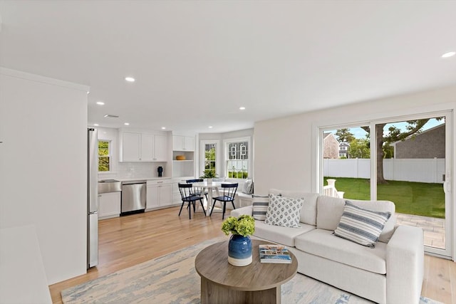 33 Dexter Ave, Sandwich, MA 02563 - living area with light wood-style flooring and recessed lighting