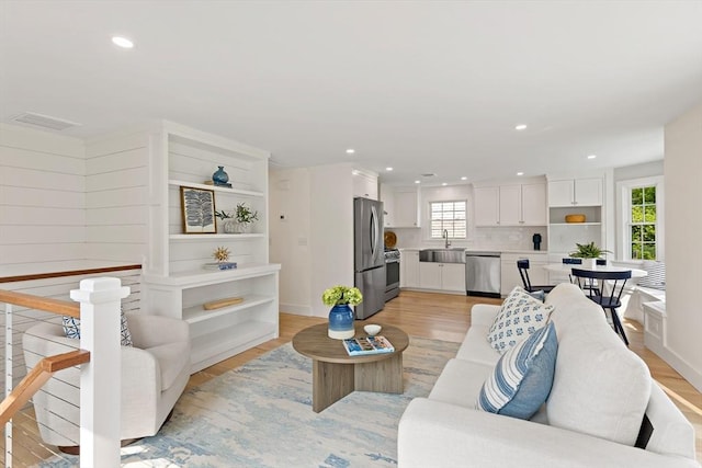 33 Dexter Ave, Sandwich, MA 02563 - living area featuring light wood-type flooring and recessed lighting
