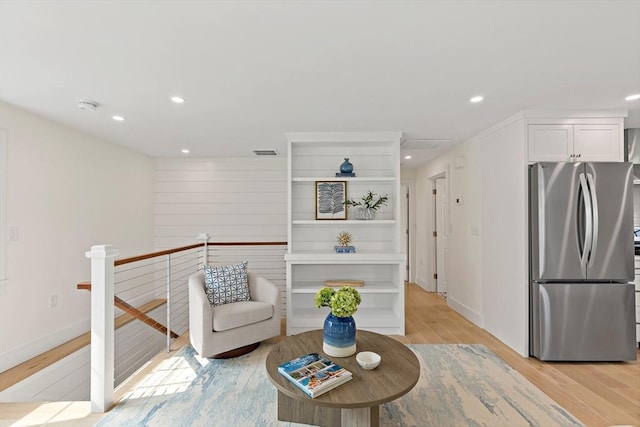 33 Dexter Ave, Sandwich, MA 02563 - sitting room with light wood-type flooring, recessed lighting, an upstairs landing, and baseboards