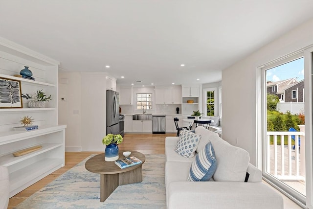 33 Dexter Ave, Sandwich, MA 02563 - living room with recessed lighting and light wood finished floors