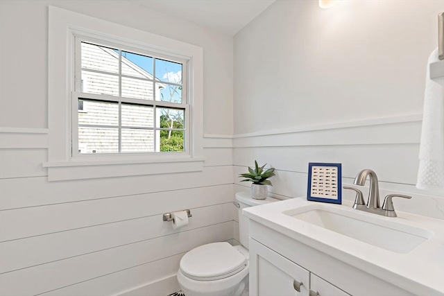33 Dexter Ave, Sandwich, MA 02563 - half bathroom with toilet, vanity, and a wainscoted wall
