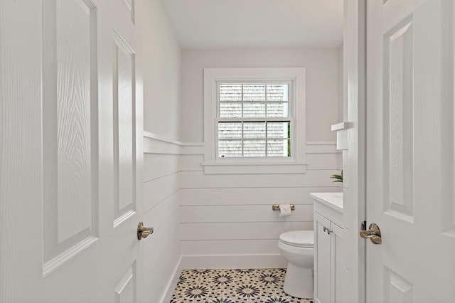 33 Dexter Ave, Sandwich, MA 02563 - bathroom featuring vanity, toilet, and a wainscoted wall