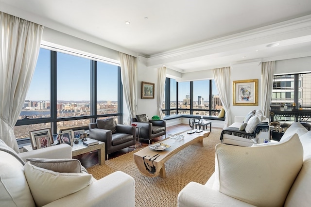 living room with plenty of natural light and ornamental molding