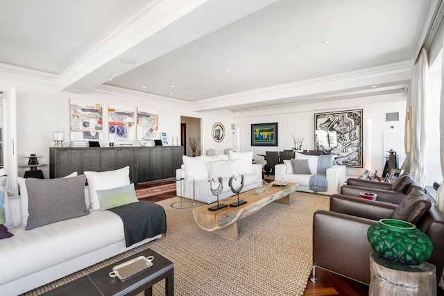 living room with crown molding, parquet flooring, and a raised ceiling