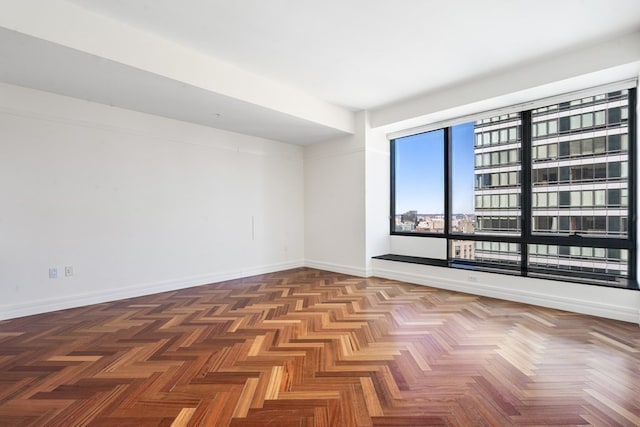 spare room with parquet flooring