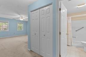 hall featuring baseboards
