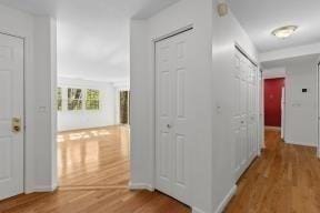 corridor featuring wood finished floors