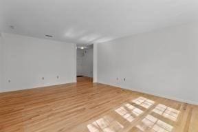 empty room with wood finished floors
