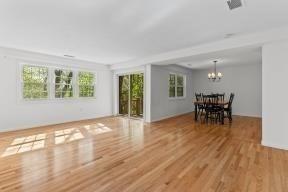 living area featuring a chandelier and wood finished floors