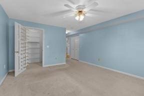 unfurnished bedroom with carpet flooring and baseboards