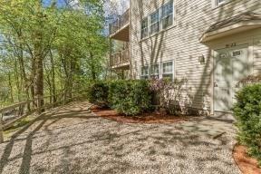 view of side of property featuring a balcony