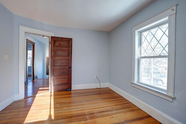 spare room featuring light wood-type flooring