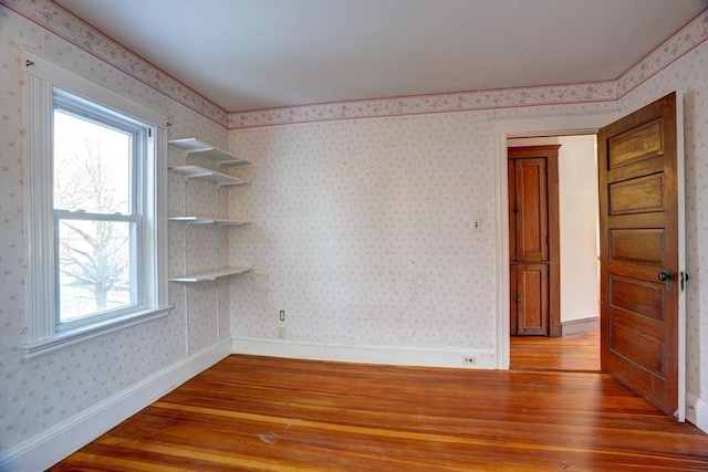 empty room featuring hardwood / wood-style flooring