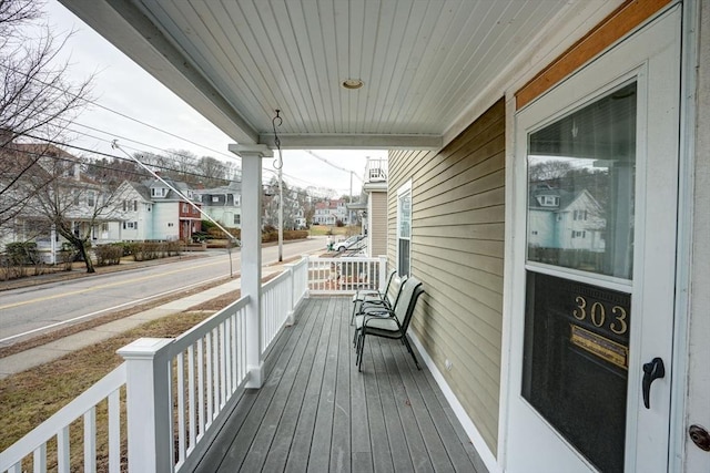 wooden terrace featuring a porch