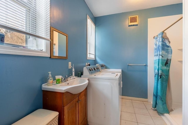 bathroom featuring washing machine and clothes dryer, a shower with curtain, tile patterned flooring, and vanity