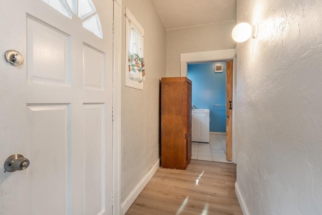 corridor with light hardwood / wood-style floors