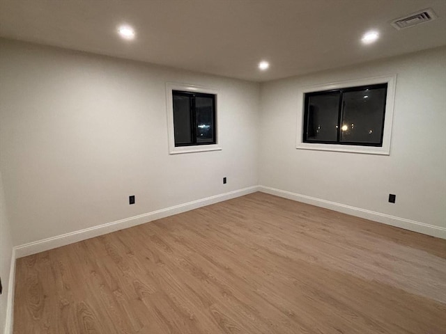 unfurnished room with light hardwood / wood-style floors