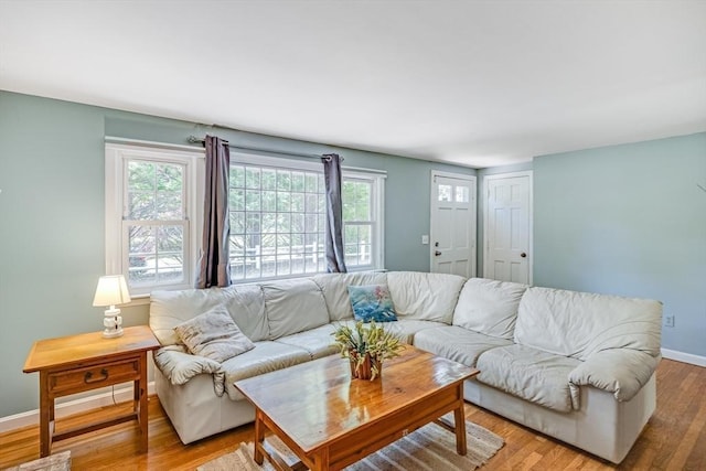 24 Powderhorn Way, Sandwich, MA 02563 - living area featuring healthy amount of natural light and light wood-style flooring