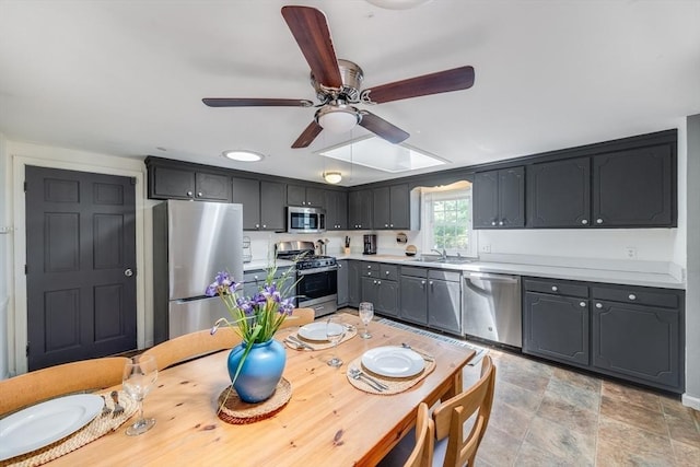 24 Powderhorn Way, Sandwich, MA 02563 - kitchen featuring appliances with stainless steel finishes, ceiling fan, light countertops, and stone finish flooring