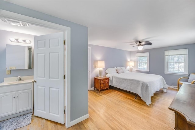24 Powderhorn Way, Sandwich, MA 02563 - bedroom with light wood finished floors and a ceiling fan