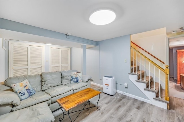 24 Powderhorn Way, Sandwich, MA 02563 - living room featuring light wood finished floors and stairway
