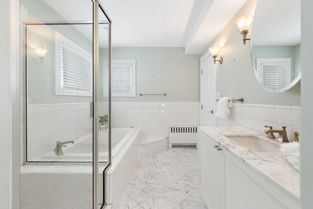 17 Perry St, Somerville, MA 02143 - bathroom with radiator heating unit, vanity, a bath, marble finish floors, and a shower stall